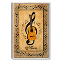 Framed guitar wall art with musical notes, a large treble clef, and warm vintage-inspired tones