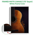 Framed matte canvas guitar wall art shown with a white frame and close-up detail