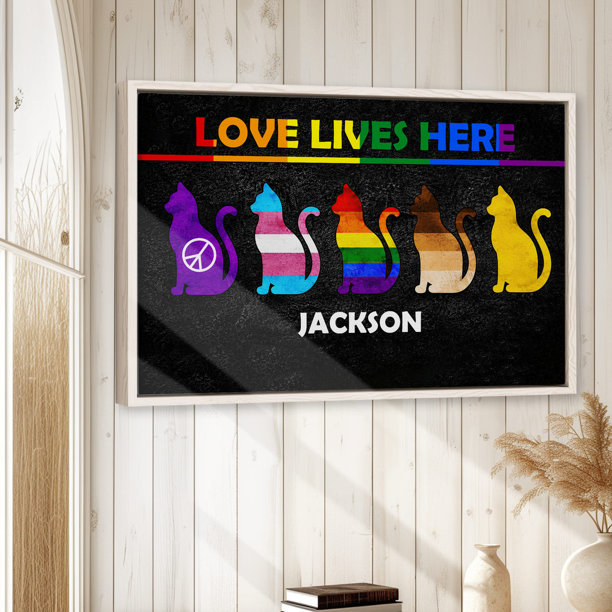 LGBT cat wall art displayed in a bright room with white wood panel walls