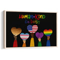 Framed LGBT wall art with colorful pride hearts held by diverse hands on a black background