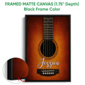Black framed matte canvas guitar wall art with a detailed close-up acoustic guitar design