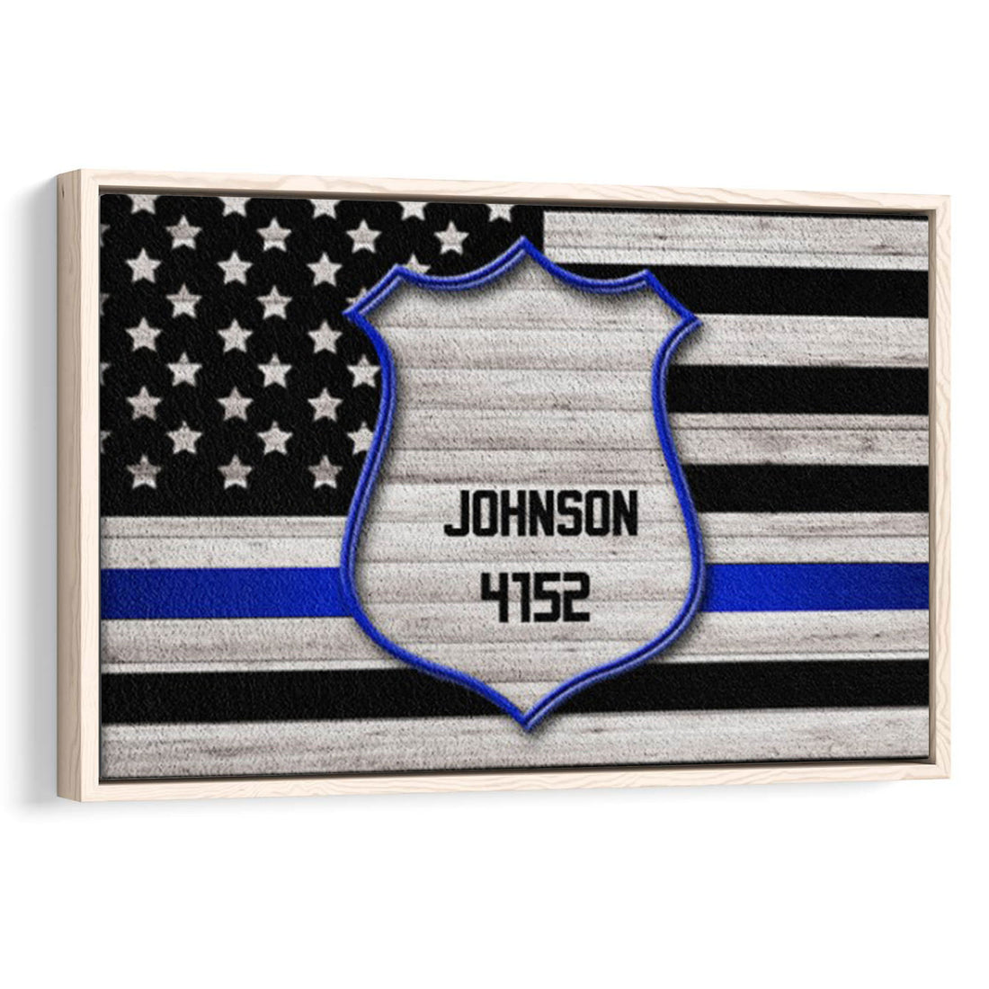 Framed police badge wall art with a blue line American flag design in black and gray