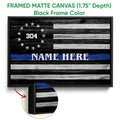 Black framed canvas police wall art with a rustic flag design and blue line detail