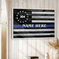 Framed police wall art displayed on a light wood-paneled wall in a home interior