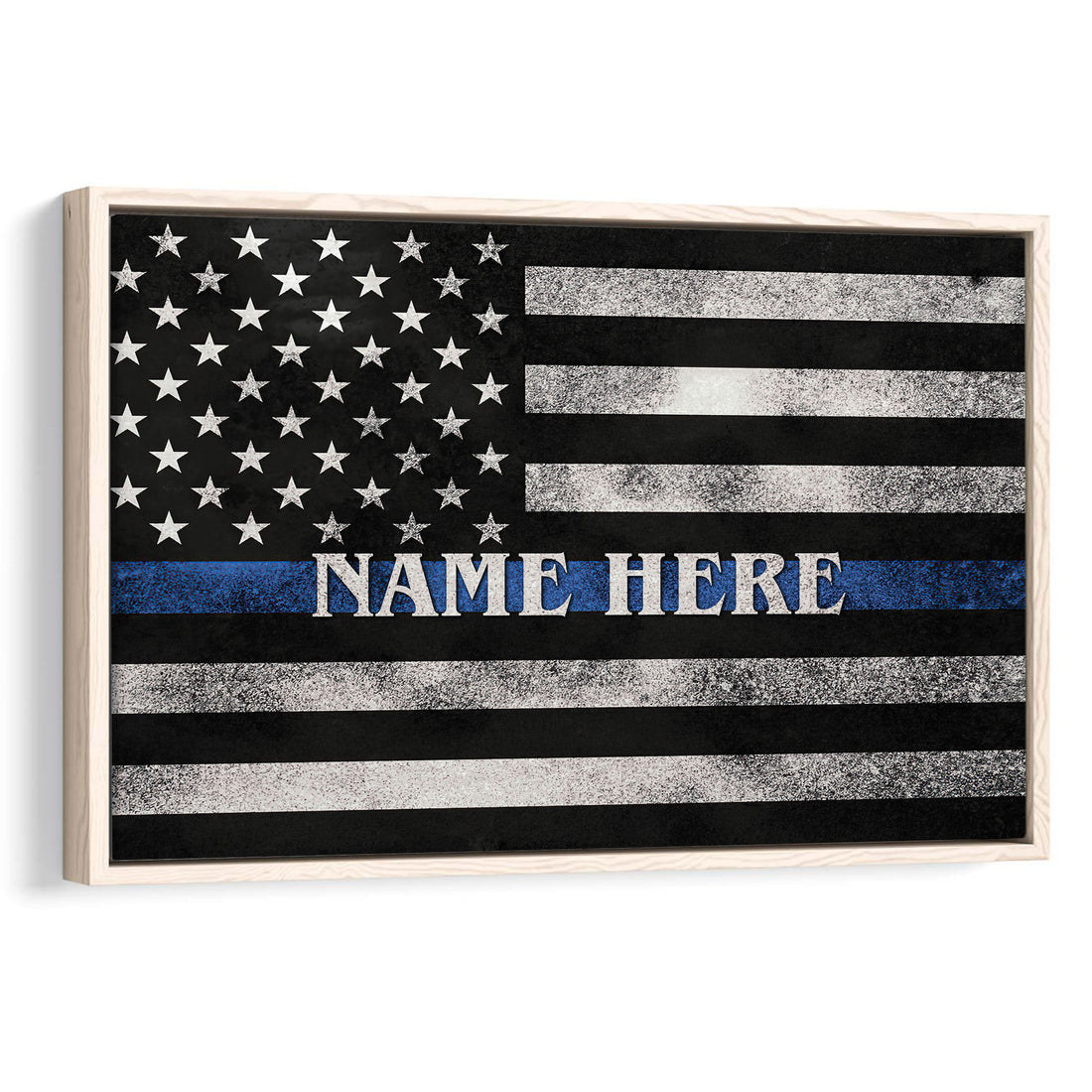 Framed police wall art featuring a distressed black and white flag with a blue line