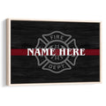 Framed firefighter wall art with a fire department emblem, black wood-look background, and red stripe