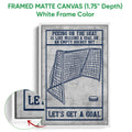 White framed hockey canvas wall art with a goal net, puck illustration, and navy message border
