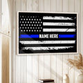 Police thin blue line flag wall art displayed in a bright room with white wood paneling