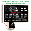 Framed firefighter canvas wall art shown in a natural wood frame with bold black and white artwork