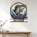 Bass fishing wall sign displayed on a light wood-paneled wall above a console table