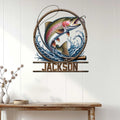 Trout fishing wall sign displayed on a light wood-paneled wall above a rustic console table