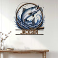 Fishing wall decor displayed above a console table, featuring a leaping fish and dramatic blue water design