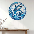 Shark wall decor displayed above a console table, showing three sharks leaping through waves