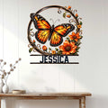 Floral butterfly metal wall sign displayed on a light paneled wall in a welcoming home