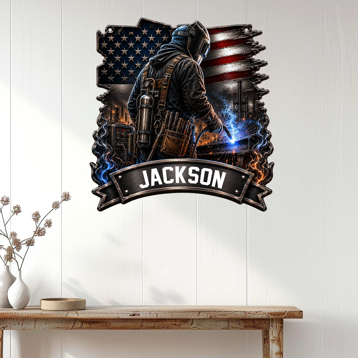 Patriotic welder metal sign displayed on a white paneled wall as workshop or garage-inspired decor