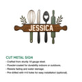Cut metal kitchen sign featuring cooking utensils, leafy accents, and a rustic woodgrain nameplate design