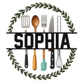 Kitchen utensil metal sign featuring spatulas, spoons, forks, a knife, whisk, and leafy wreath