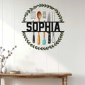 Custom kitchen wall sign displayed on white paneling above a rustic console table