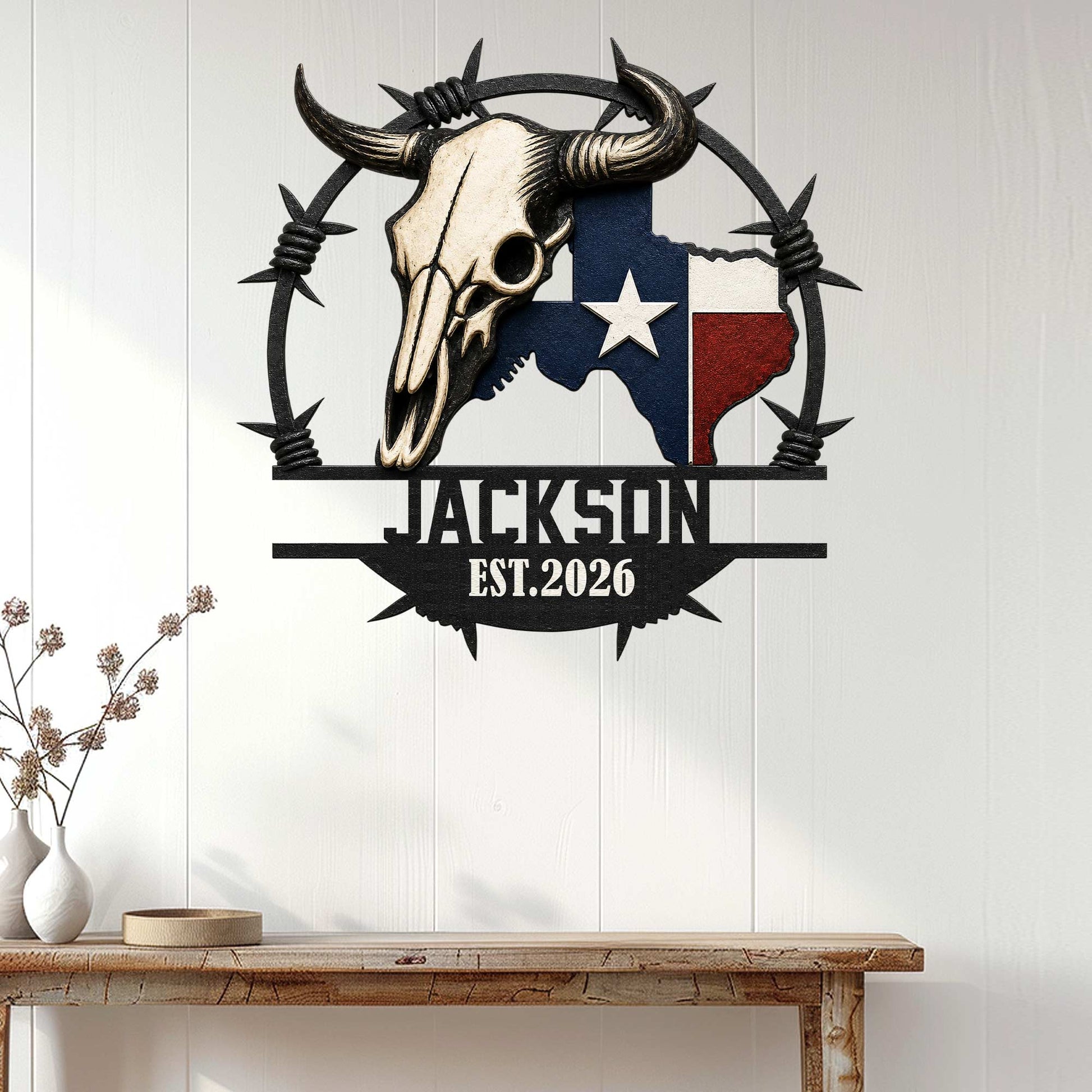 Texas longhorn skull wall sign displayed on a white paneled wall above a rustic console table