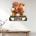 Floral Pomeranian wall sign displayed on a light wood-paneled wall above a console table