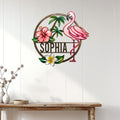 Tropical flamingo wall decor displayed on a white paneled wall above a wood console table