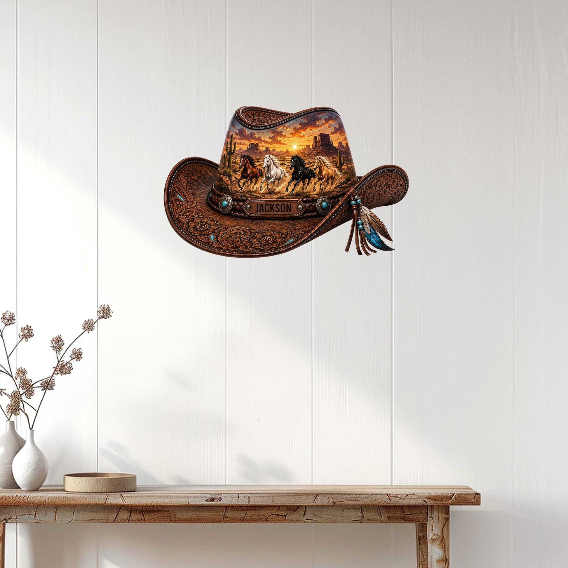 Cowboy hat shaped wall sign displayed on a white paneled wall above a rustic console table
