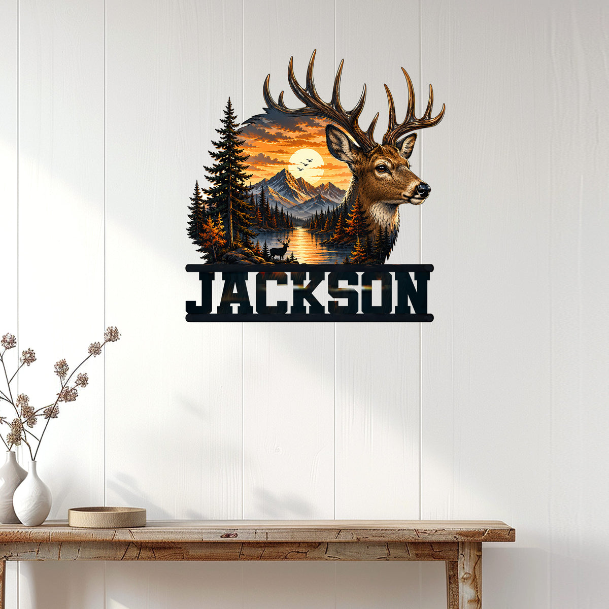 Deer metal wall decor displayed on a white paneled wall above a rustic wood console