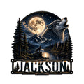 Wolf metal sign featuring a howling wolf beneath a full moon over mountains, pine forest, lake, and cabin