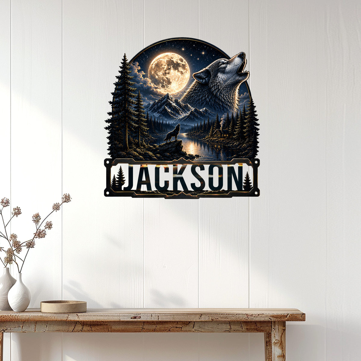 Howling wolf metal sign displayed on a light wood-paneled wall above a console table