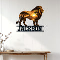 Lion wildlife metal sign displayed on a light wood-paneled wall above a console table