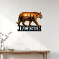 Tiger wall sign displayed on white wood paneling above a rustic console table in a modern home
