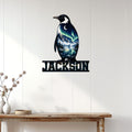Penguin wall sign displayed on white paneled walls above a console table in a modern home
