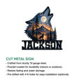 Wolf wall sign showing a moonlit mountain landscape with pine trees, a howling wolf, and a bold metal frame