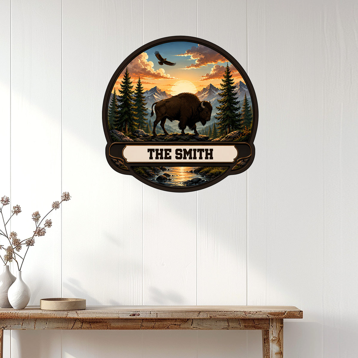 Custom bison wall sign displayed on a white paneled wall above a rustic console table