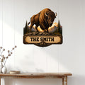 Bison wall sign displayed on a light wood-paneled wall in a rustic home setting