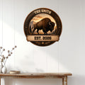 Rustic bison wall decor displayed on a white paneled wall above a wooden console table