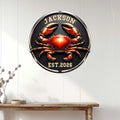 Glossy red crab metal sign displayed as coastal wall decor above a console table in a bright home