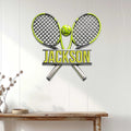 Tennis wall decor displayed above a console table, featuring crossed rackets and a bright green ball