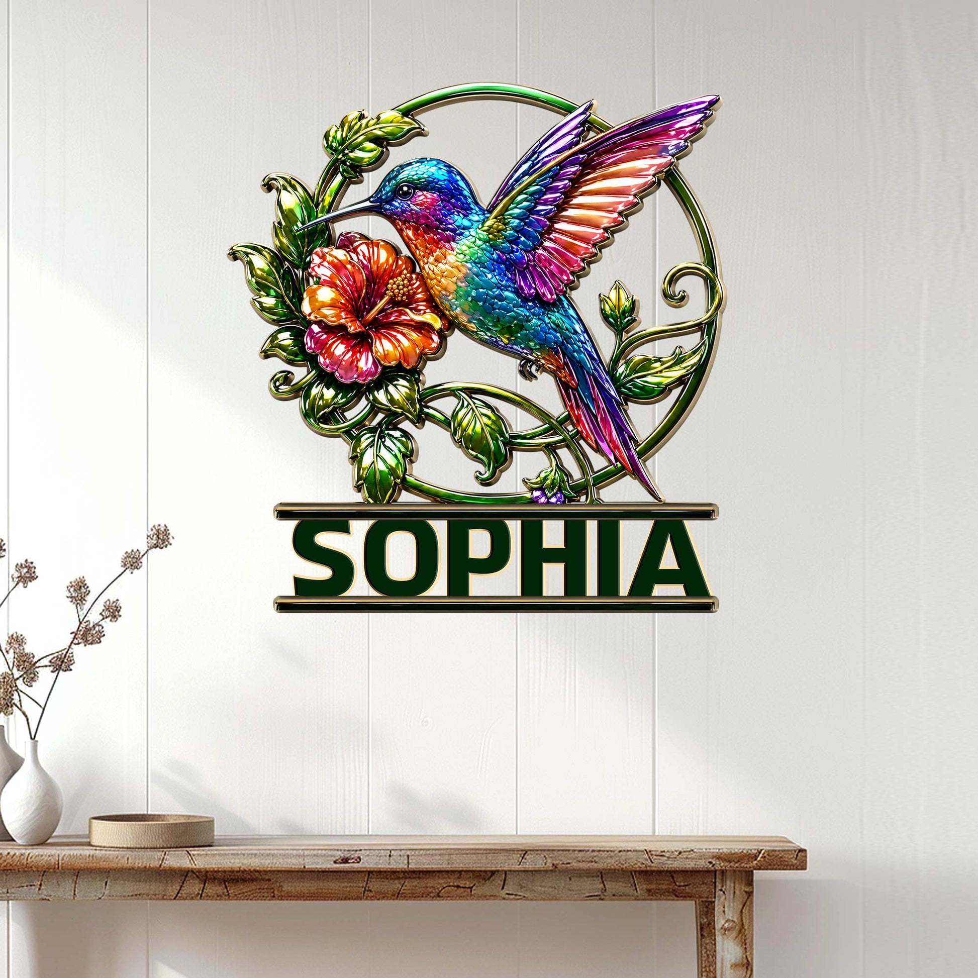 Colorful hummingbird wall sign displayed on a white paneled wall above a console table