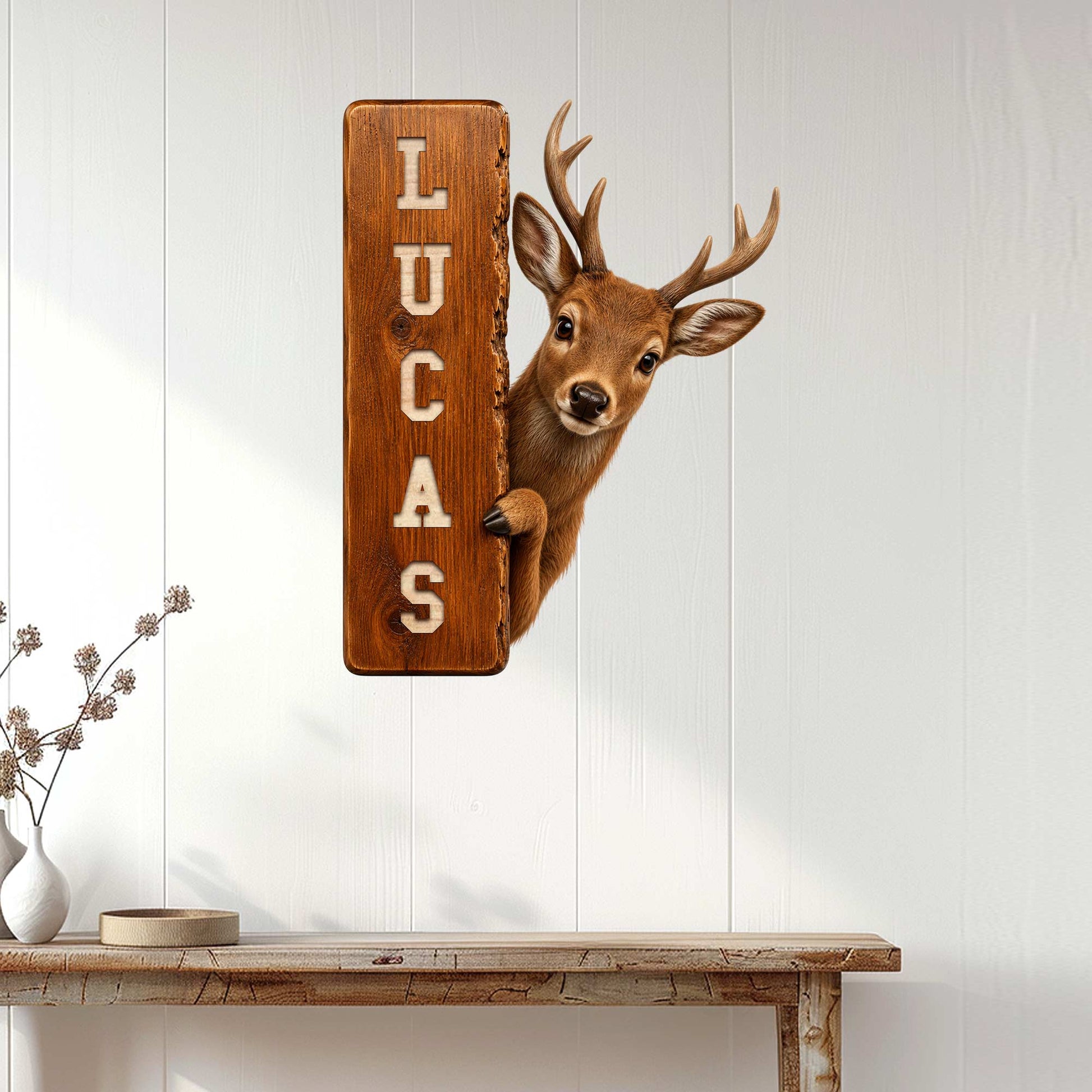 Rustic deer hunting wall sign displayed on a white paneled wall above a console table