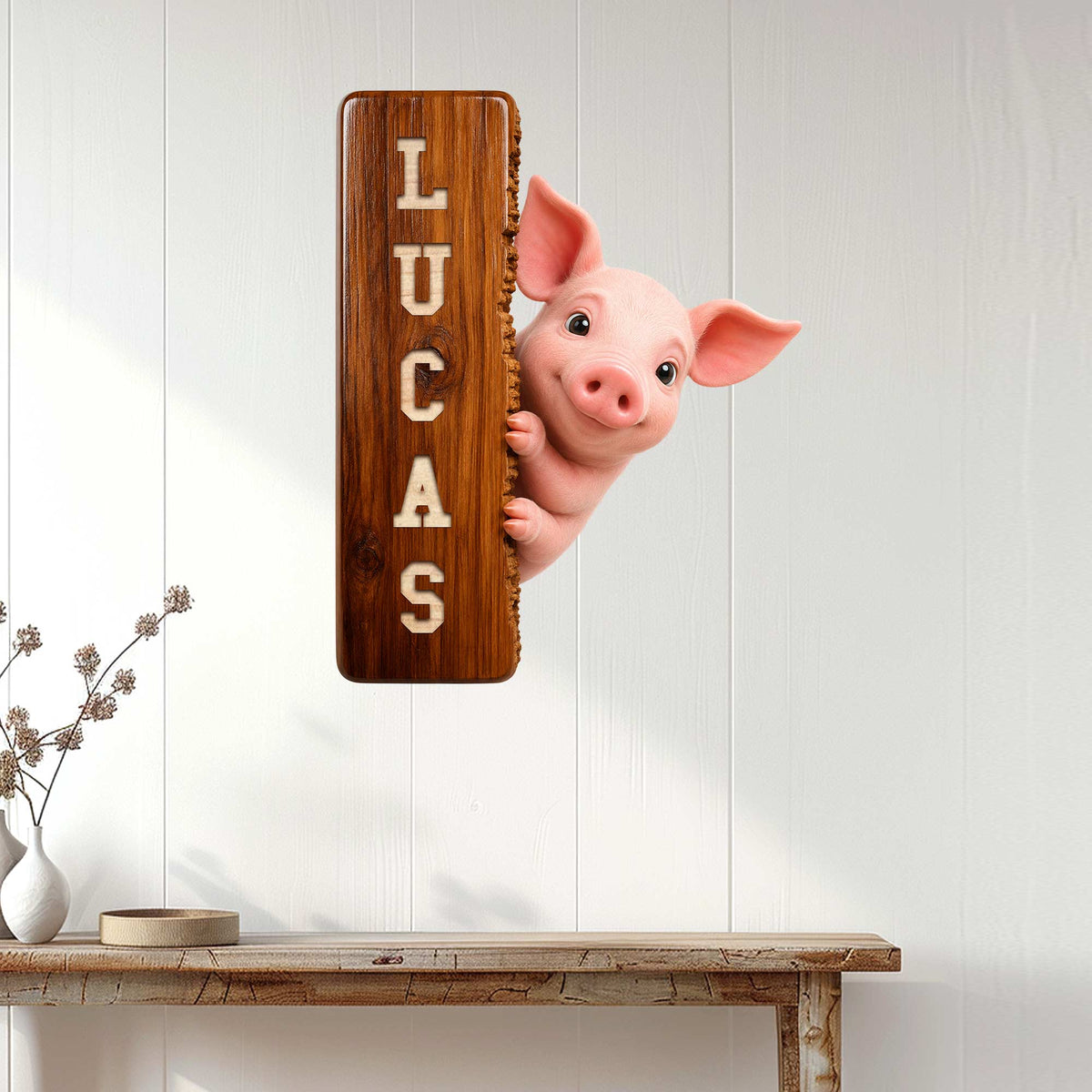 Pig metal sign displayed on a white paneled wall above a rustic console table