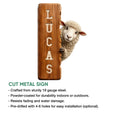 Cut metal sheep sign with a playful lamb peeking from behind a rustic vertical board