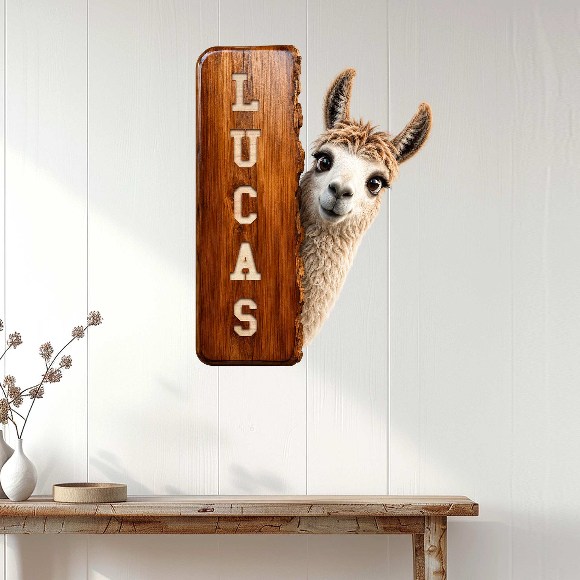 Custom llama metal sign displayed on a white paneled wall above a console table