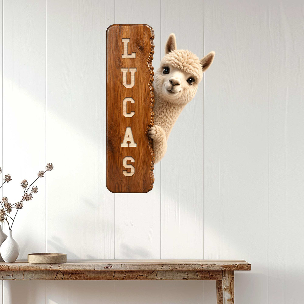 Rustic alpaca wall sign displayed on a white paneled wall above a console table