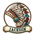 Native American feather headdress metal sign with a jeweled medallion and decorative plaque design