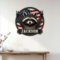 Patriotic raccoon wall sign displayed on a white paneled wall above a wooden console table