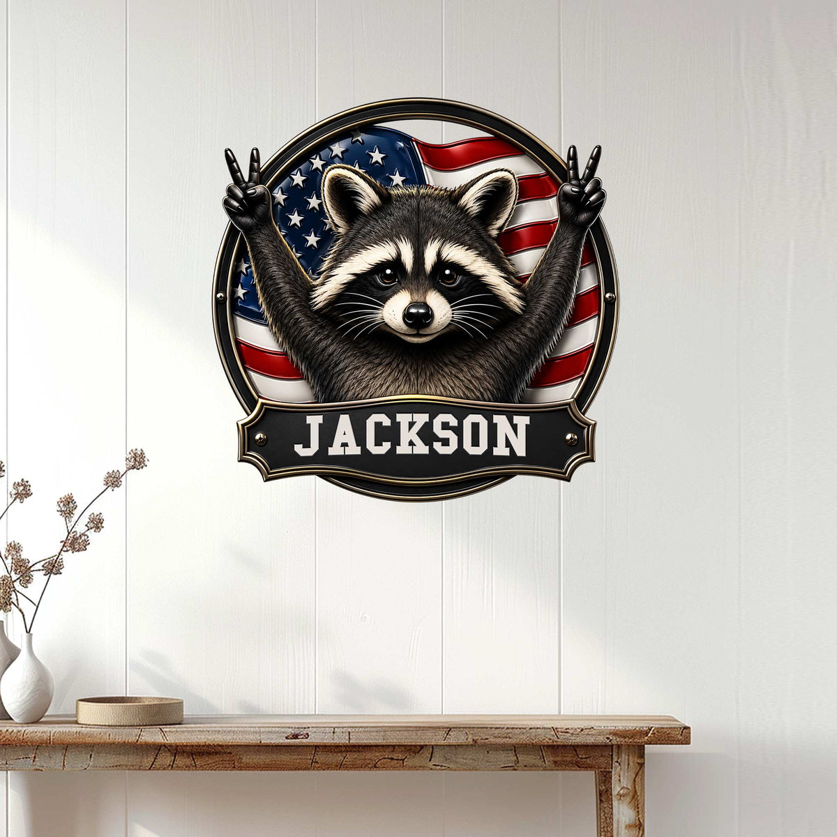 Patriotic raccoon wall sign displayed on a white paneled wall above a wooden console table