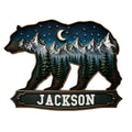 Custom bear-shaped metal sign featuring snowy mountains, evergreen forest, stars, and a crescent moon