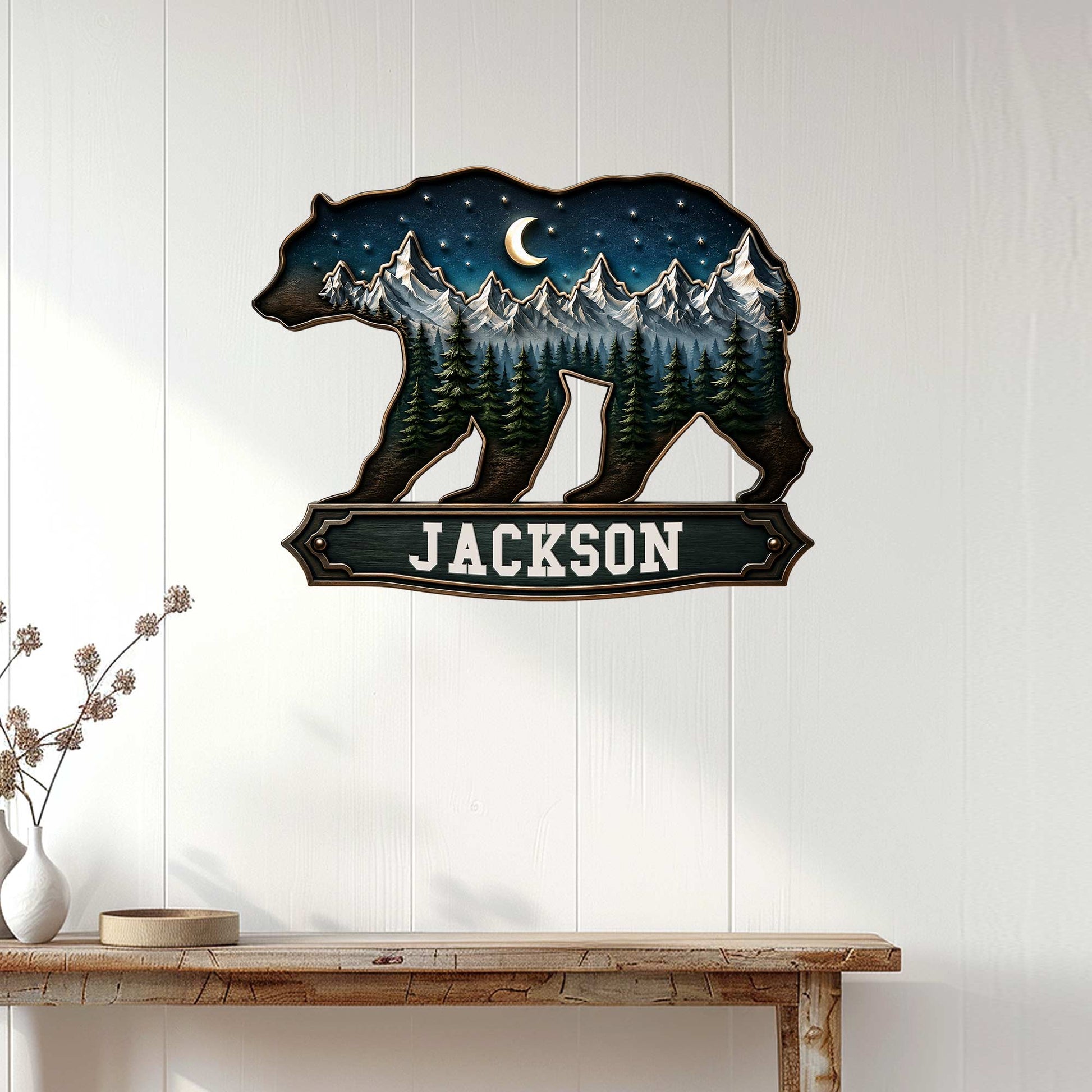 Bear mountain metal sign displayed on a light wood-paneled wall in a nature-inspired home setting