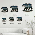 Bear-shaped metal sign size guide showing several available dimensions in a living room display